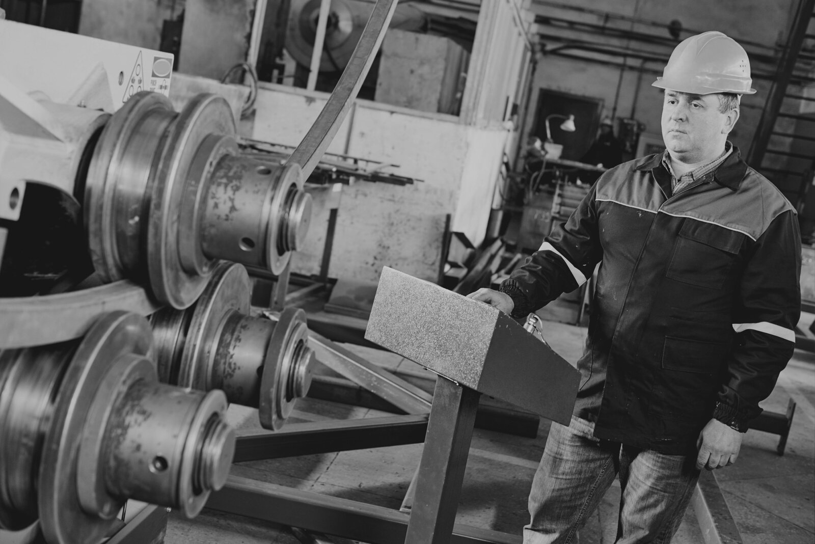 Factory Worker with Tube Bending Machine